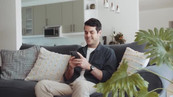 Caucasian Man Relaxing Sitting Couch Home Typing Smiles Message Receives — Stok video