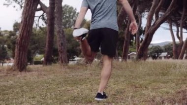 Caucasian man stretching leg before going on a run. High quality 4k footage