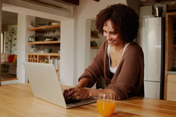 Happy Biracial Young Woman Casual Clothing Typing Laptop Kitchen Home — Stockfoto