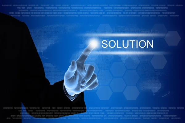 Business hand clicking solution button on touch screen Stock Photo
