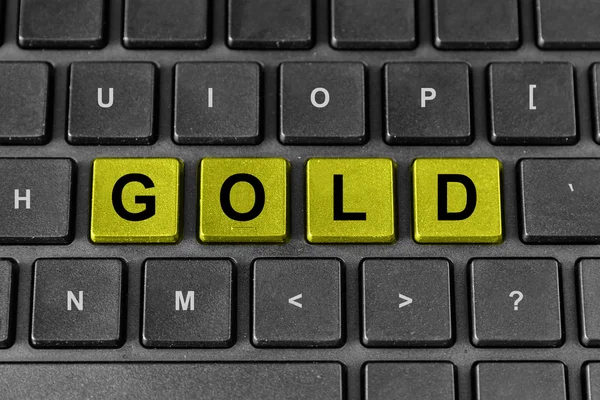 Gold word on keyboard — Stock Photo, Image