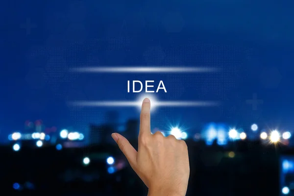 Hand pushing idea button on touch screen — Stock Photo, Image