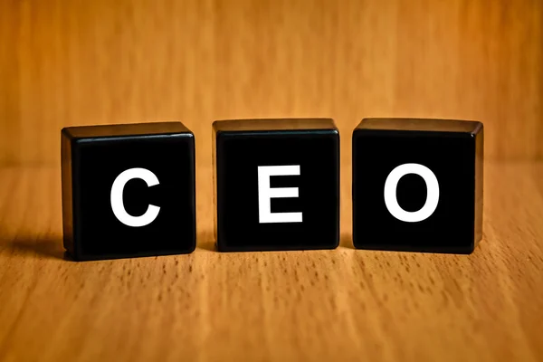 CEO or chief executive officer word on black block — Stock Photo, Image