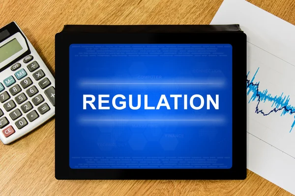 Regulation word on digital tablet — Stock Photo, Image