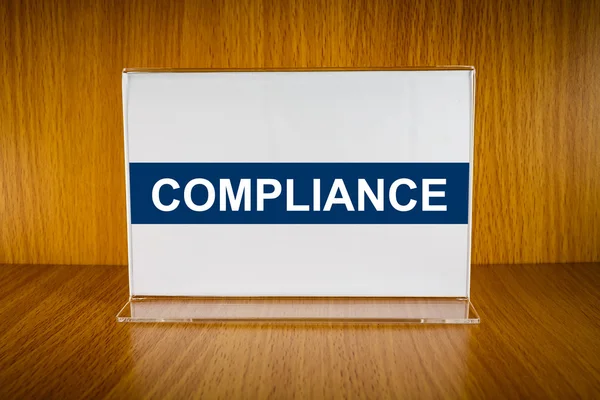 Compliance on Acrylic card holder — Stock Photo, Image