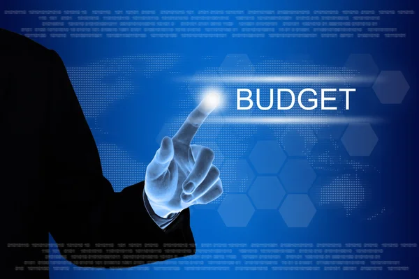 Business hand clicking budget button on touch screen — Stock Photo, Image