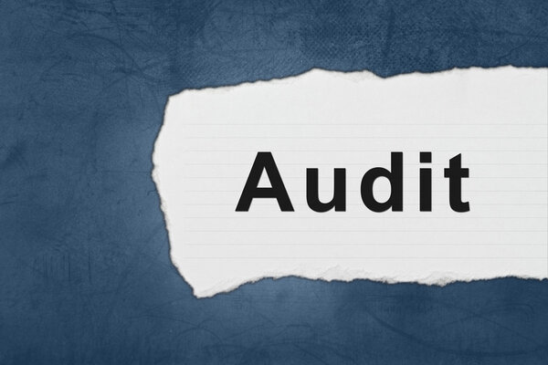 audit with white paper tears