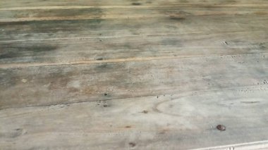 a closeup shot of a wooden table with a pattern of wood texture