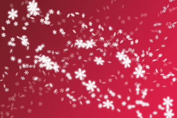 Sneeuwvlokken op rode baclground — Stockfoto