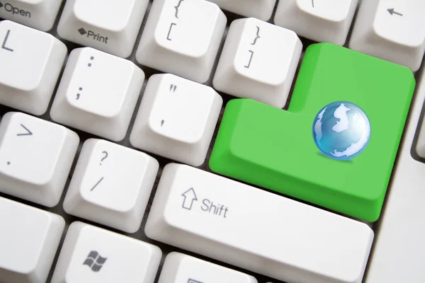 Keyboard with green earth button — Stock Photo, Image