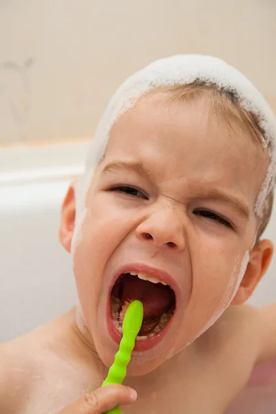 Baby cleaning his tooth — Stock Photo, Image