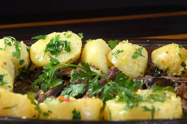 Portion Cooked Meat Potatoes Oil Herbs —  Fotos de Stock
