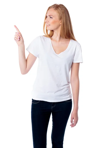 Woman pointing and looking at copyspace — Stock Photo, Image