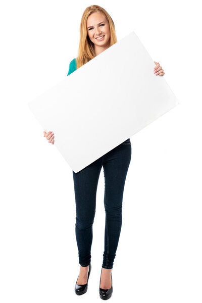 Happy woman holding a blank white board