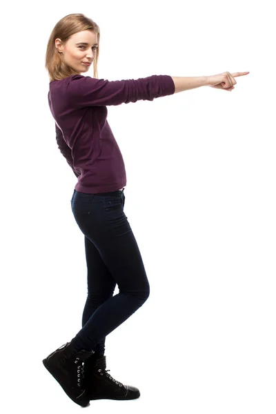 Sexy young woman pointing forwards — Stock Photo, Image