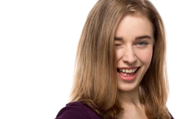 Sassy young woman giving a mischievous wink — Stock Photo, Image