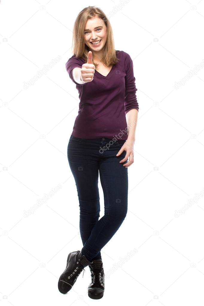 Enthusiastic young woman giving a thumbs up