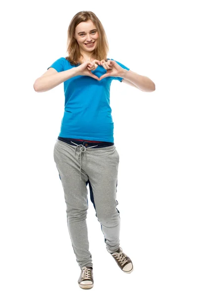 Romantic young woman making a heart gesture — Stock Photo, Image