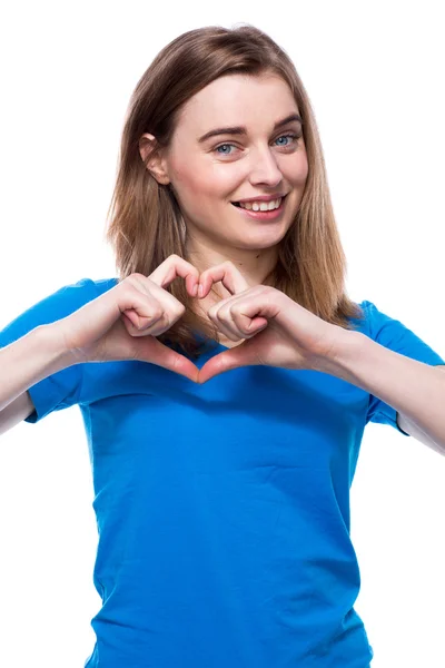 Happy young woman making a heart gesture — Stock Photo, Image