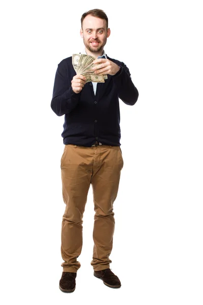 Happy young man showing off a handful of money — Stock Photo, Image