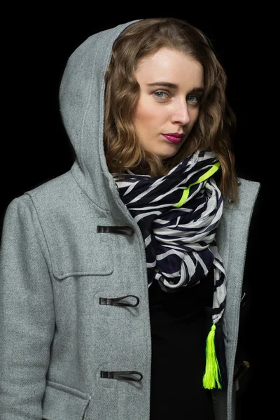 Fashionable woman in a grey hooded coat — Stock Photo, Image