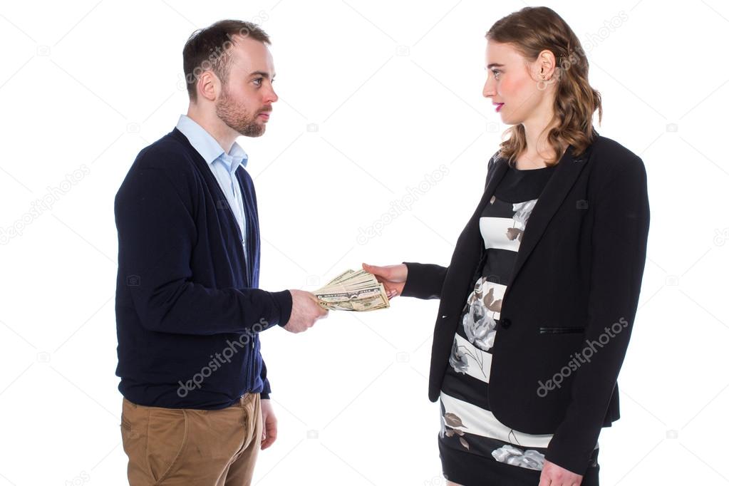 Businessman handing money to woman