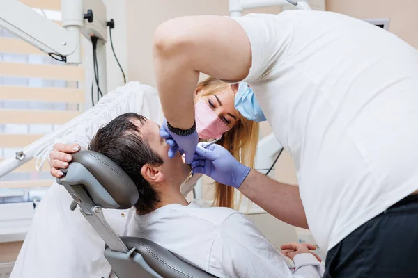 Dentist Doctor Looks Patient Teeth Holds Dental Instruments Mouth Assistant — Stock Photo, Image