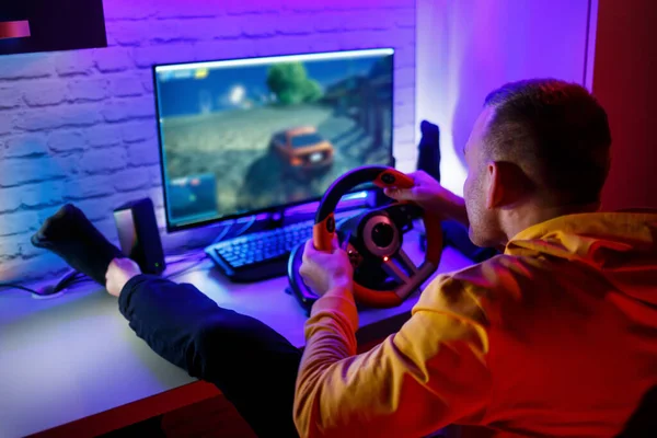 Male Gamer Playing Racing Games Computer Uses Steering Wheel Emotional — Stock Photo, Image