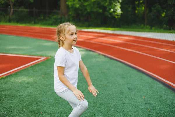Little Girl Goes Sports Grass Child Does Warm Training Stadium — Stock fotografie
