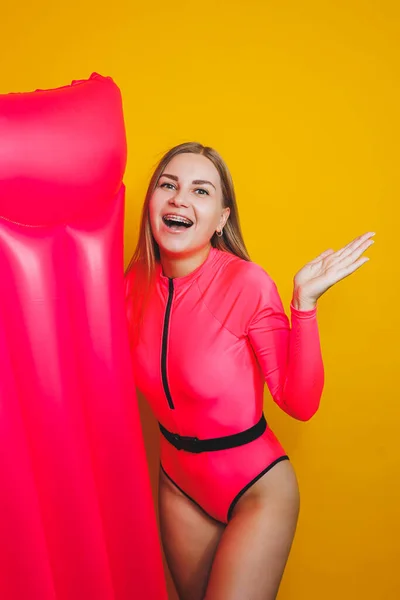 Young Slender Woman Pink Swimsuit Yellow Background Girl Inflatable Mattress — 스톡 사진