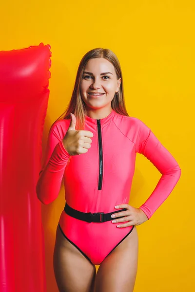Beautiful Young Smiling Woman Wearing Pink Swimsuit Posing Yellow Background — Zdjęcie stockowe