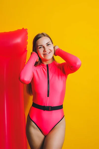Beautiful Young Smiling Woman Wearing Pink Swimsuit Posing Yellow Background — Stockfoto