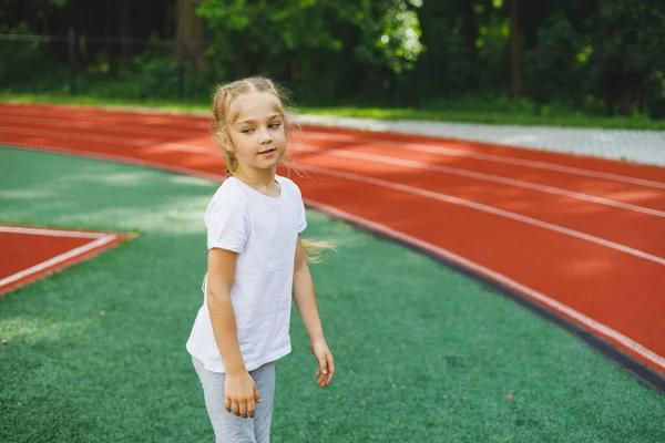 Little Girl Goes Sports Grass Child Does Warm Training Stadium — Foto de Stock