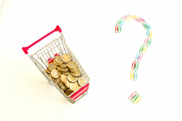 Shopping cart full of coins and question mark — Stock Photo, Image