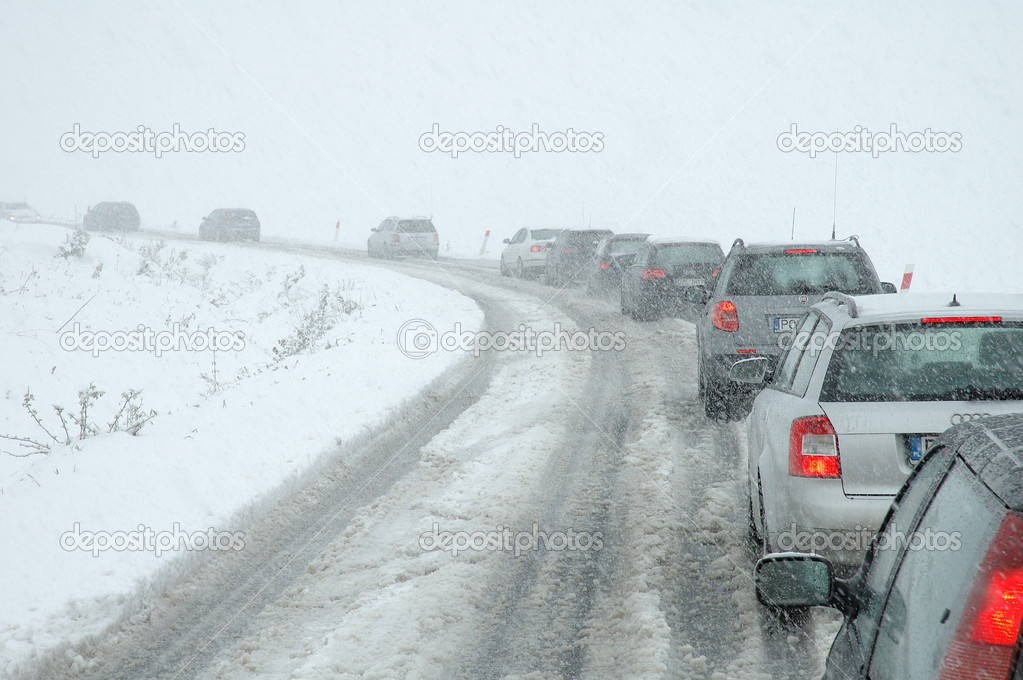 Traffic jam in heavy snowfall on mountain road