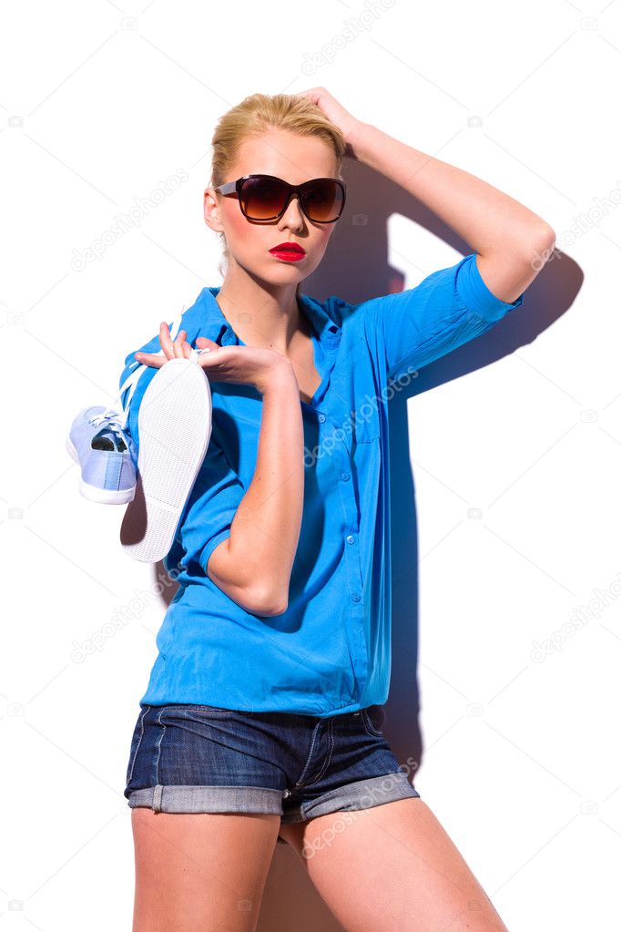 Fashion Girl With Sneakers Lean On The Wall Stock Photo Fashion Girl With Sneakers Lean On The Wall Stock Photo