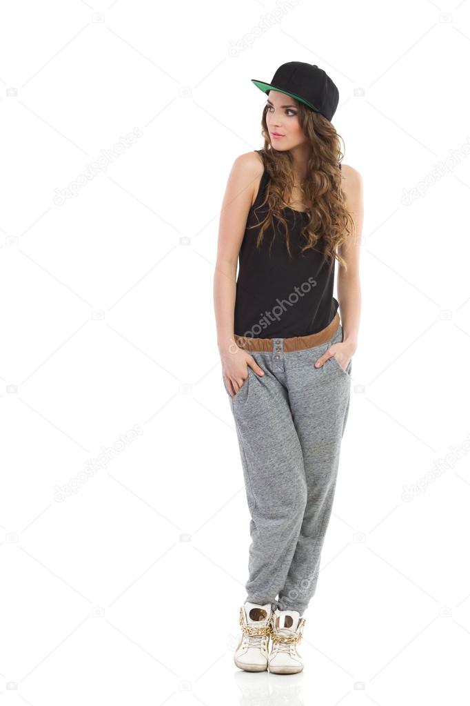 Girl in baseball cap looking away — Stock Photo © studioloco 48340979