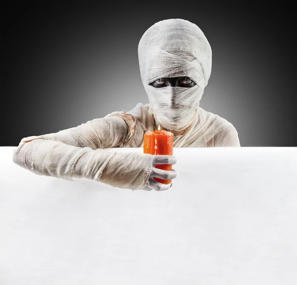 Halloween mummy with a candle — Stock fotografie