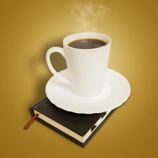 Mug of coffee on boook — Stock Photo, Image