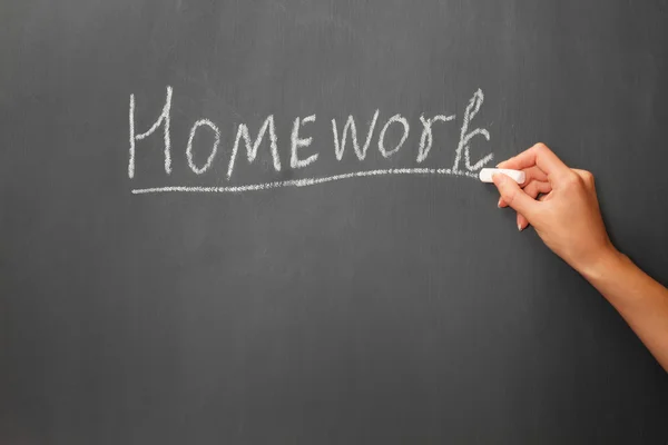 The word homework on the blackboard — Stock Photo, Image