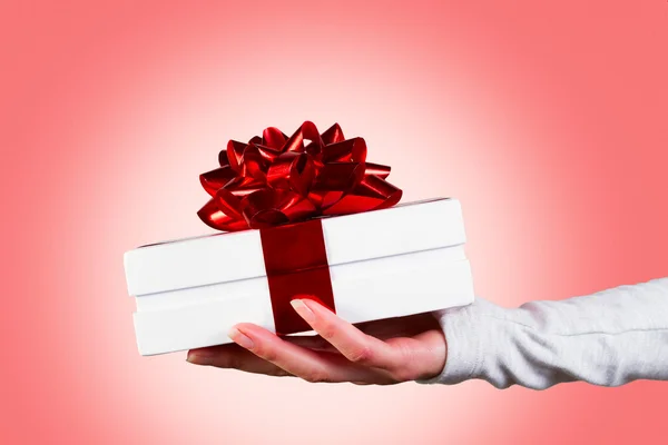 Hand offering gift — Stock Photo, Image