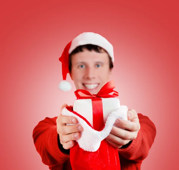 Happy man is giving presents — Stock Photo, Image