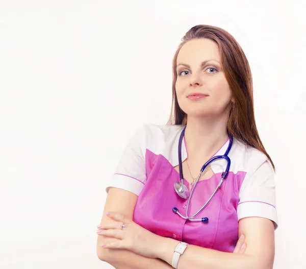 Kobieta lekarz w płaszcz różowy — Zdjęcie stockowe