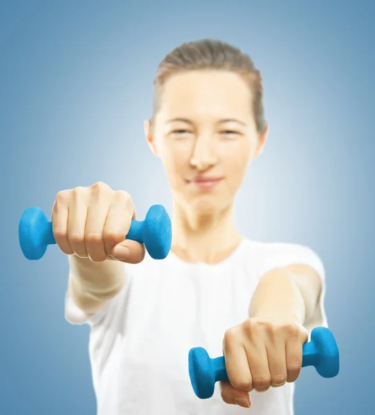 Young woman with dumbbells — Stock Photo, Image