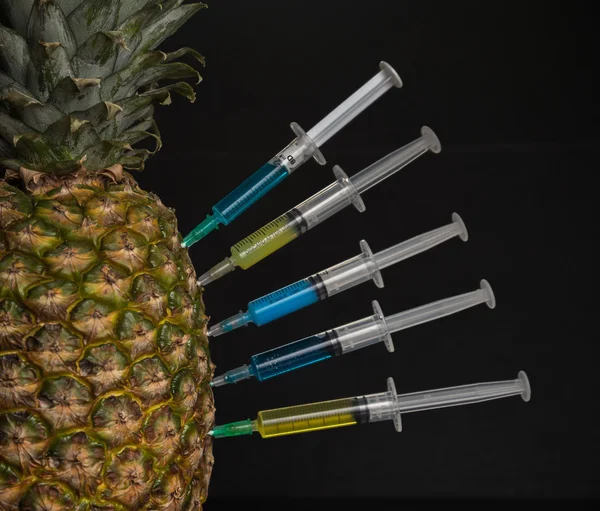 Pineapple with syringe — Stock Photo, Image