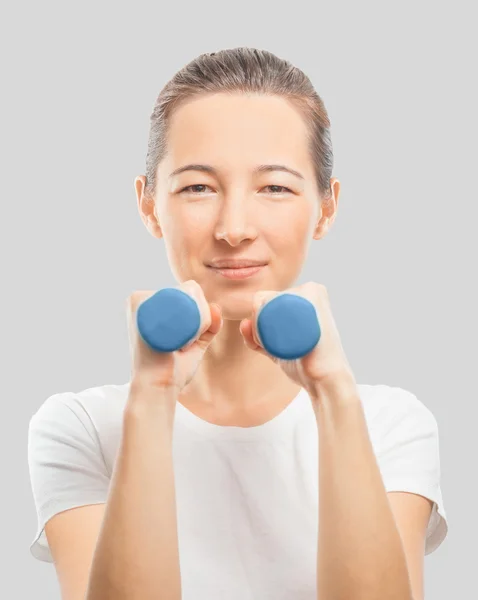 Happy woman with dumbbells — Stock Photo, Image