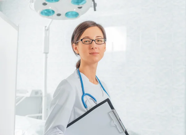 Young doctor with clipboard — Stock Photo, Image