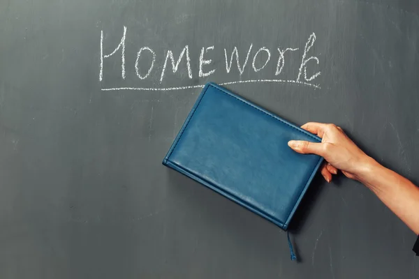 Homework on a blackboard — Stock Photo, Image