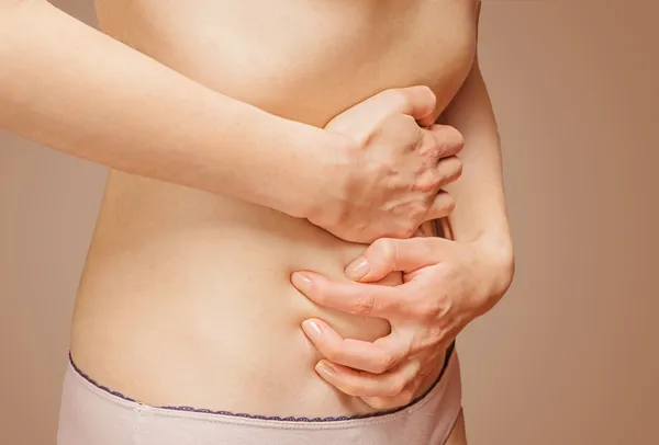 Pain in the female stomach — Stock Photo, Image