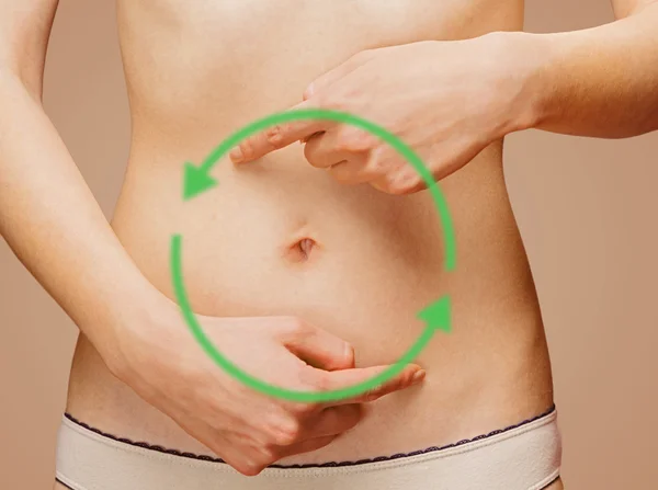 Woman points to the abdomen — Stock Photo, Image